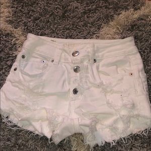 Ripped white shorts